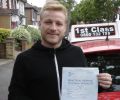 Samuel with Driving test pass certificate
